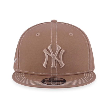 Pictured is this MLB Contrast Stitching New York Yankees 9FIFTY Snapback cap in beige. 2