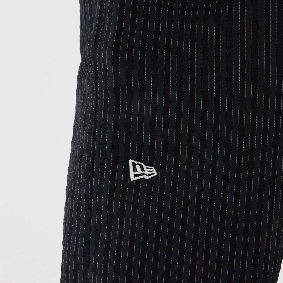 The model is wearing these New Era Street Class straight leg joggers in navy. 3