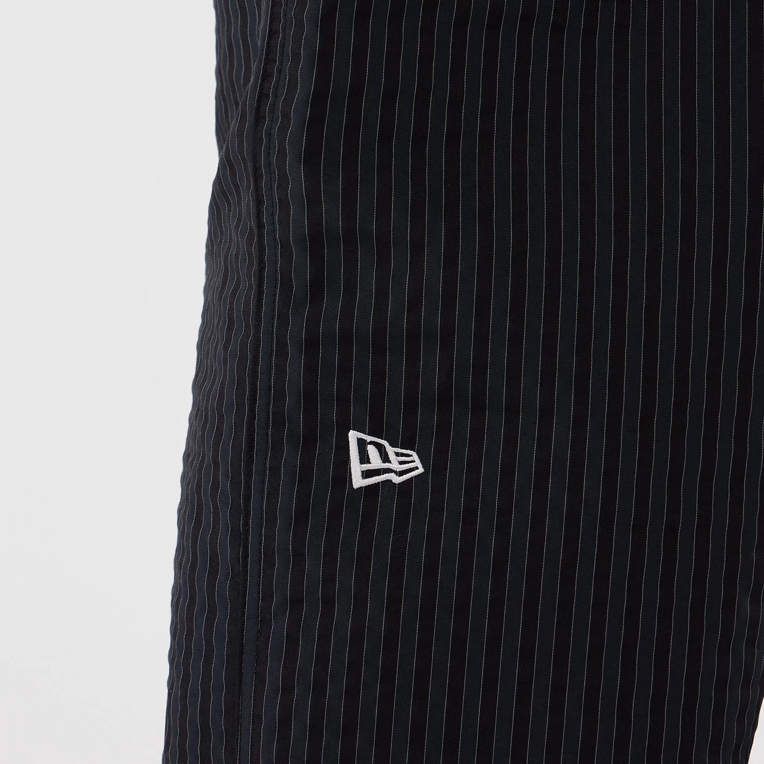 The model is wearing these New Era Street Class straight leg joggers in navy. 3