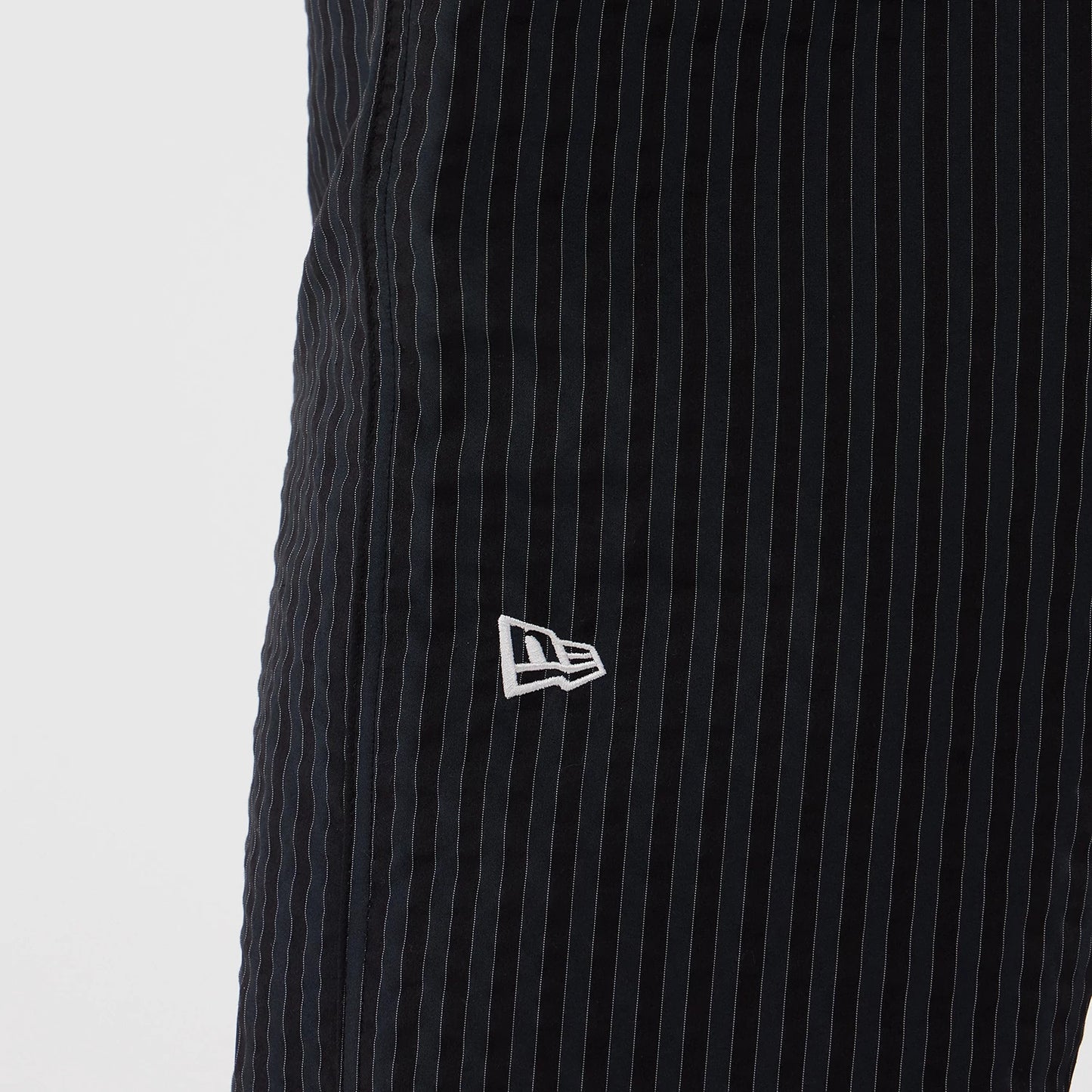 The model is wearing these New Era Street Class straight leg joggers in navy. 3