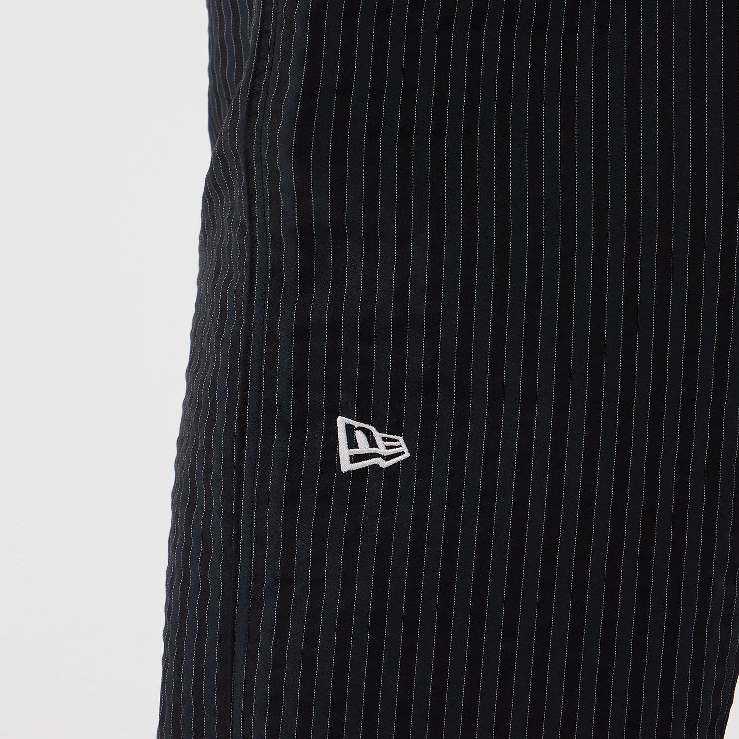 The model is wearing these New Era Street Class straight leg joggers in navy. 3