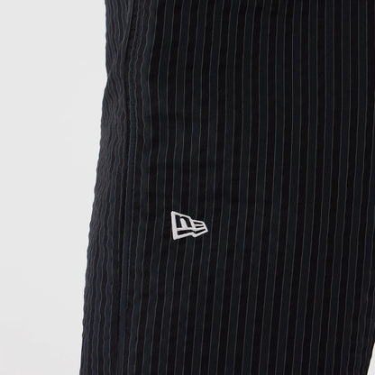 The model is wearing these New Era Street Class straight leg joggers in navy. 3