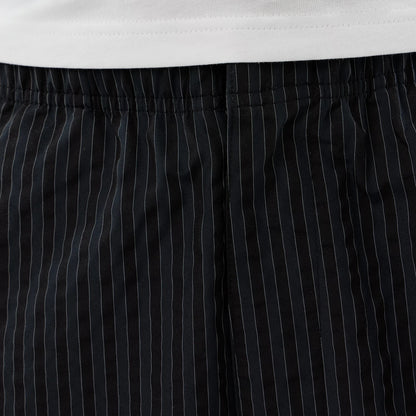 The model is wearing these New Era Street Class straight leg joggers in navy. 4