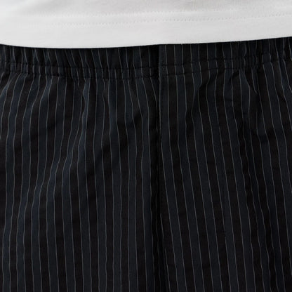 The model is wearing these New Era Street Class straight leg joggers in navy. 4