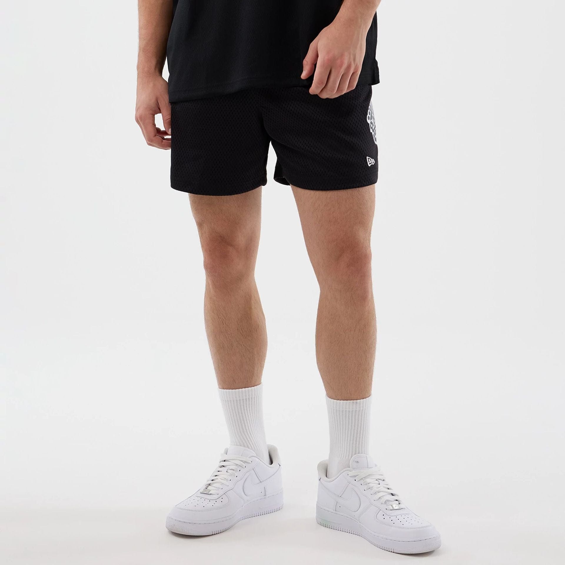 The Male model is wearing LA Kings NHL Street Culture Black Oversized Shorts  7