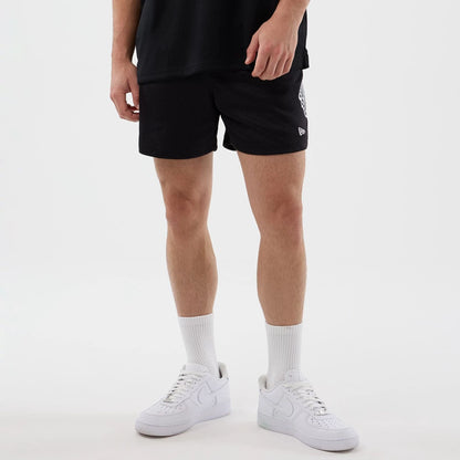 The Male model is wearing LA Kings NHL Street Culture Black Oversized Shorts  7