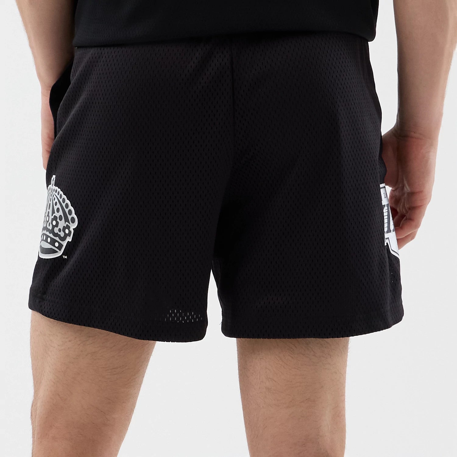 The Male model is wearing LA Kings NHL Street Culture Black Oversized Shorts 6