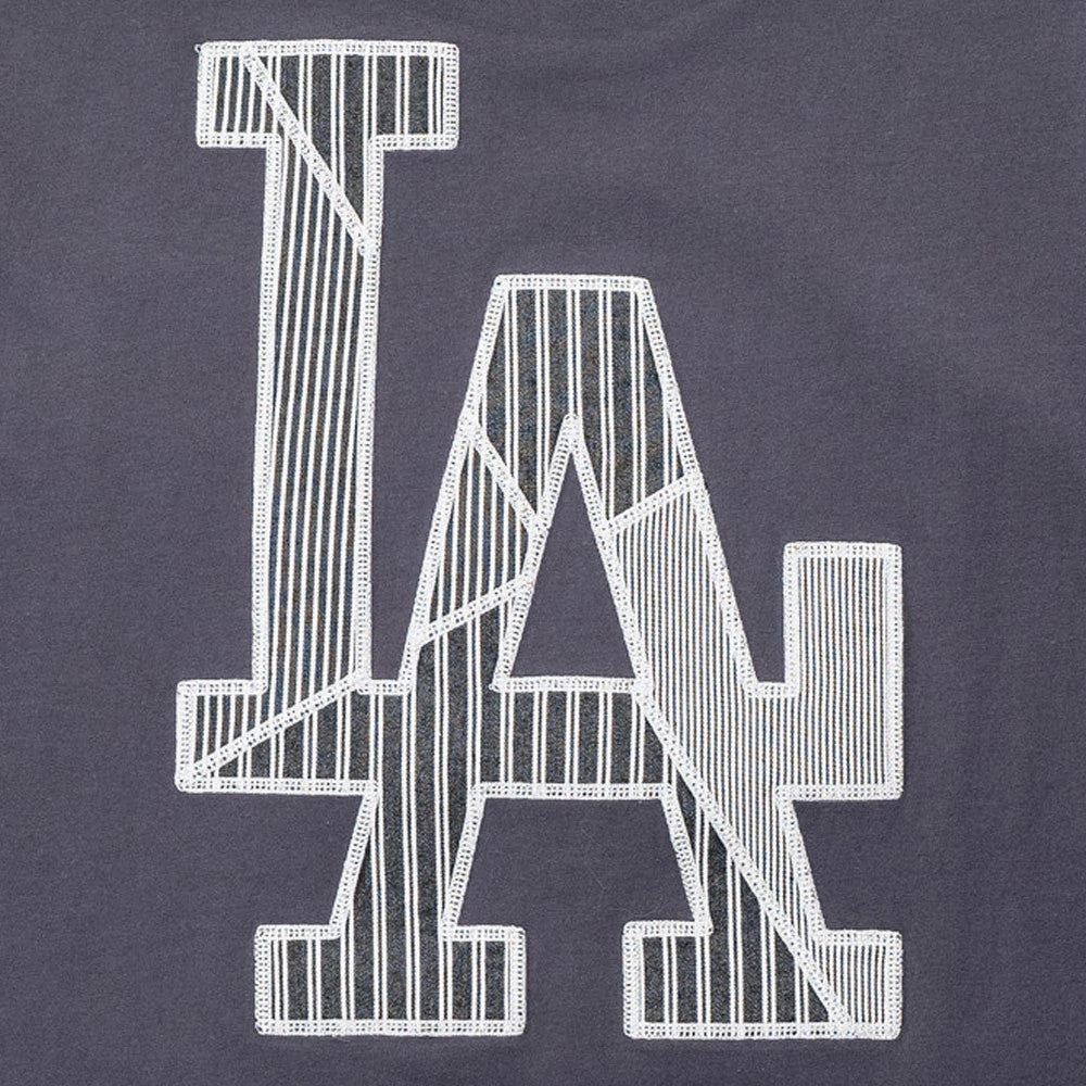 New Era LA Dodgers MLB Patchwork Grey T-Shirt, front view showing a large patchwork LA logo with white embroidered edges on a grey fabric, featuring different striped patterns within the letters.