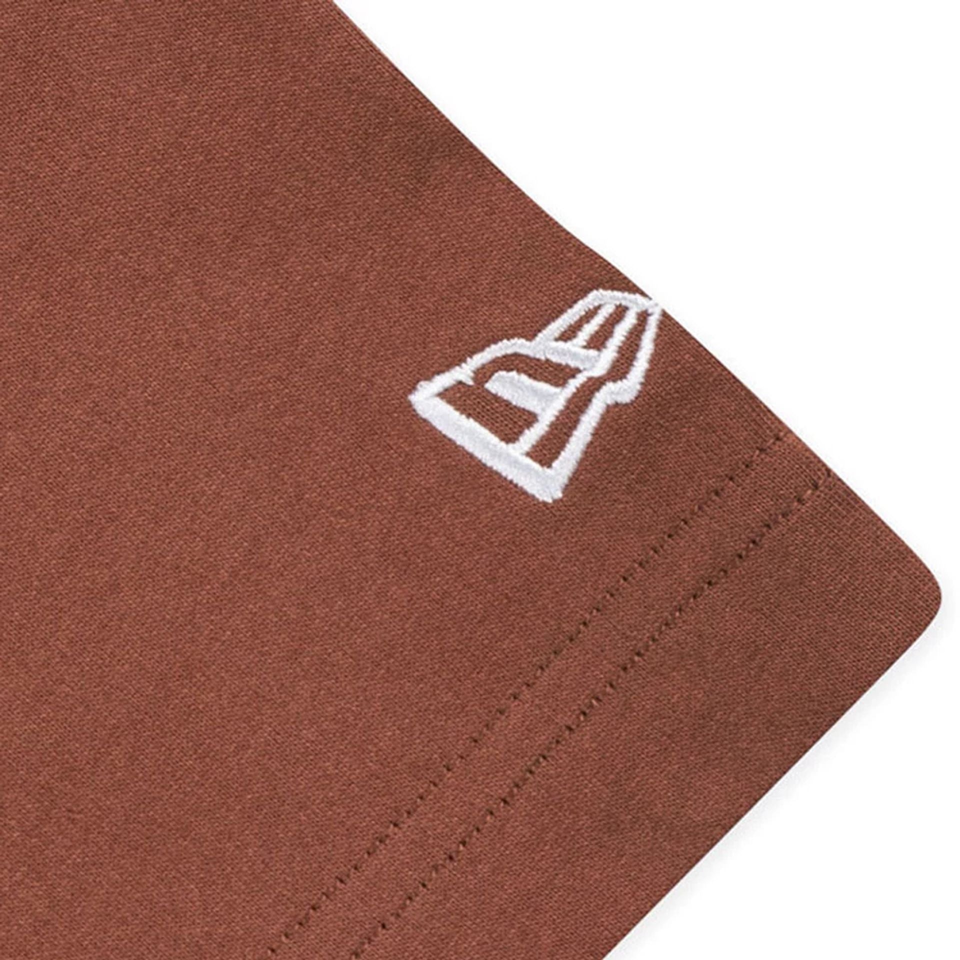 The model is wearing this New Era Mountain Logo T-Shirt in Open Brown. 4
