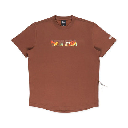 The model is wearing this New Era Mountain Logo T-Shirt in Open Brown. 1