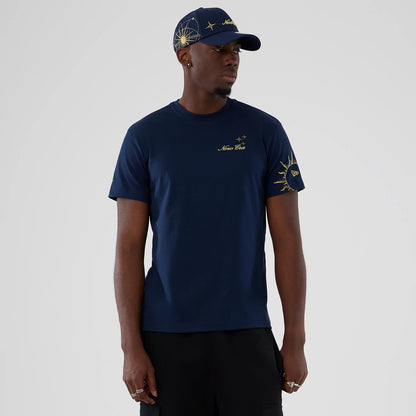 The model is wearing this New Era Cosmic Craft T-Shirt in blue. 1