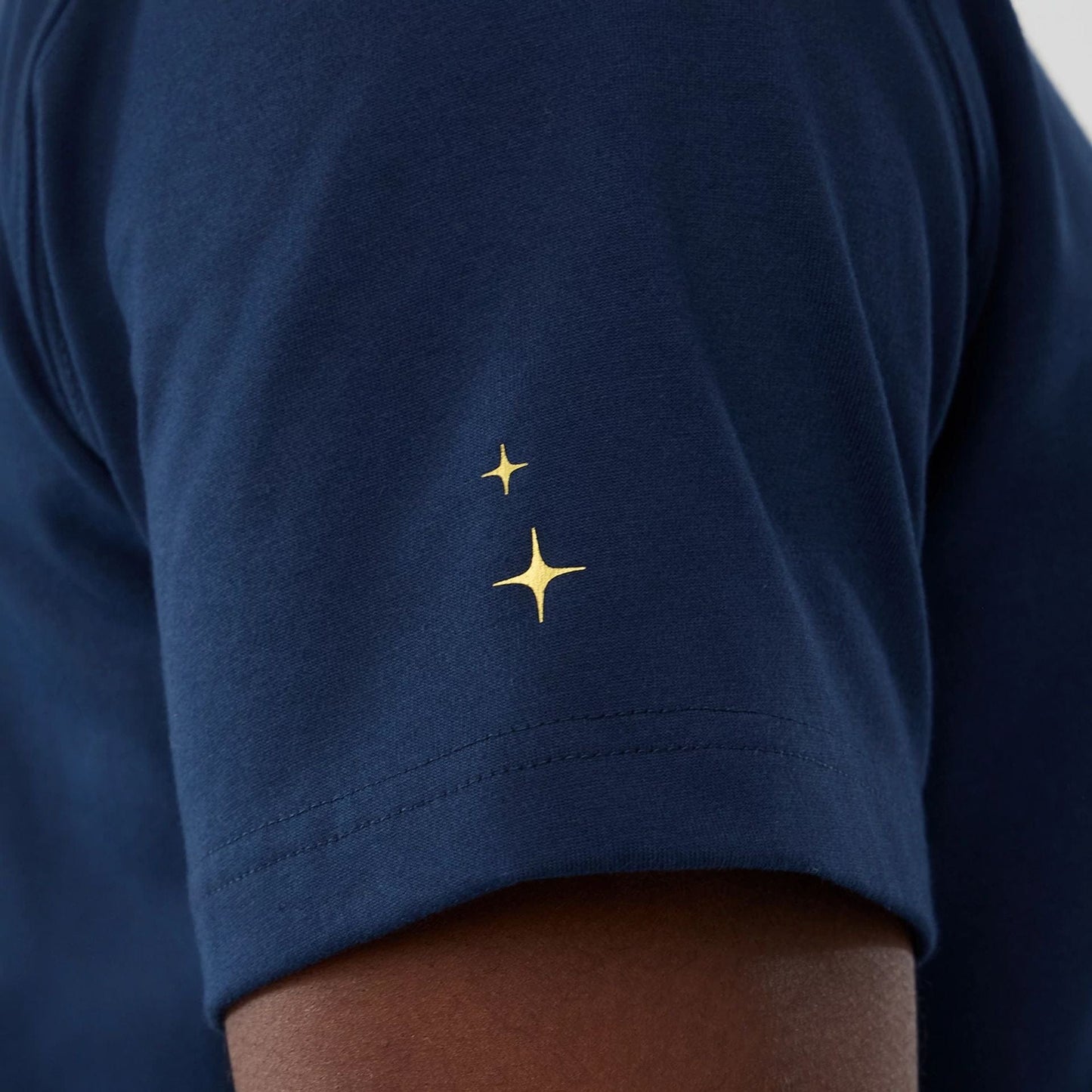The model is wearing this New Era Cosmic Craft T-Shirt in blue. 5