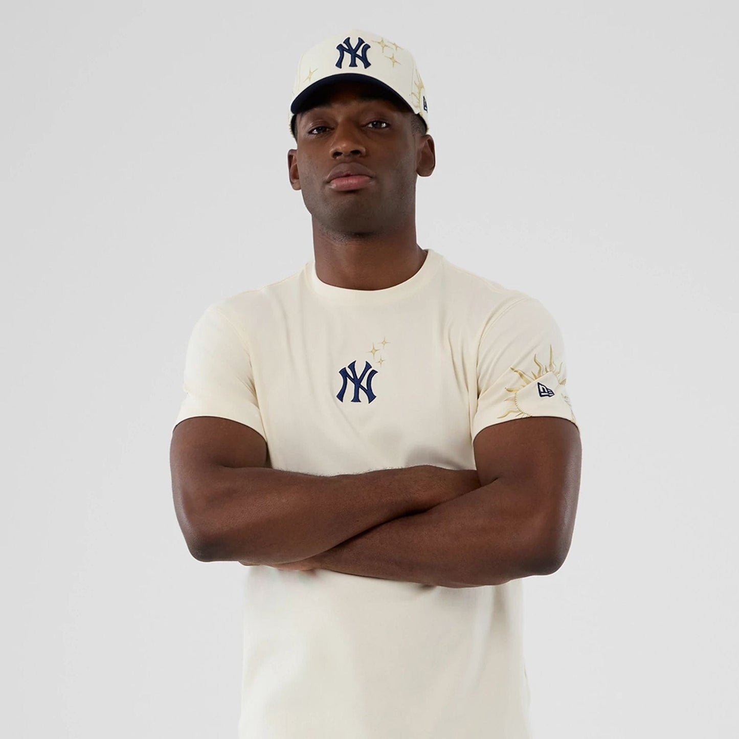 The model is wearing this MLB Cosmic Craft New York Yankees T-Shirt in white. 7