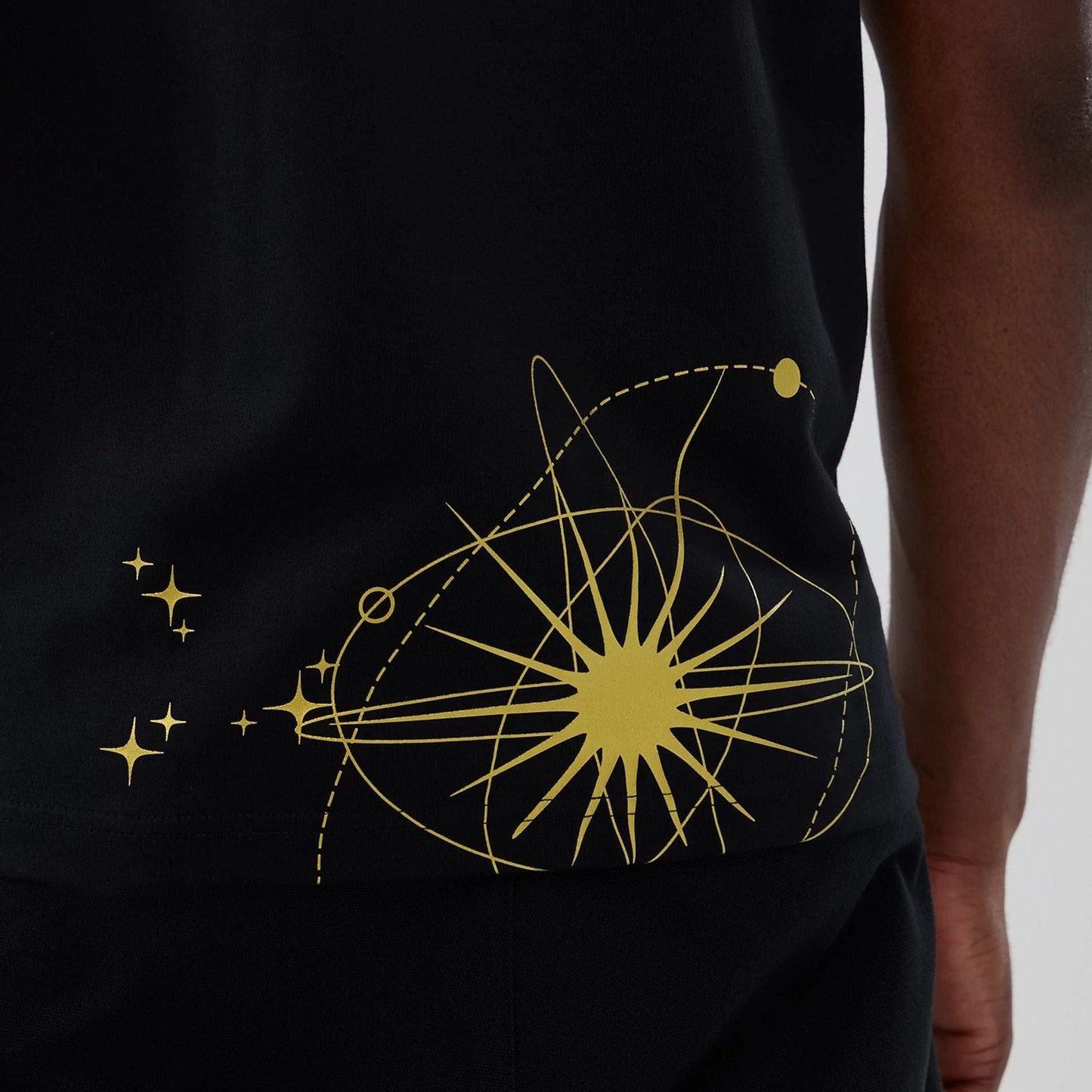 The model is wearing this New Era Cosmic Craft T-Shirt in black. 5