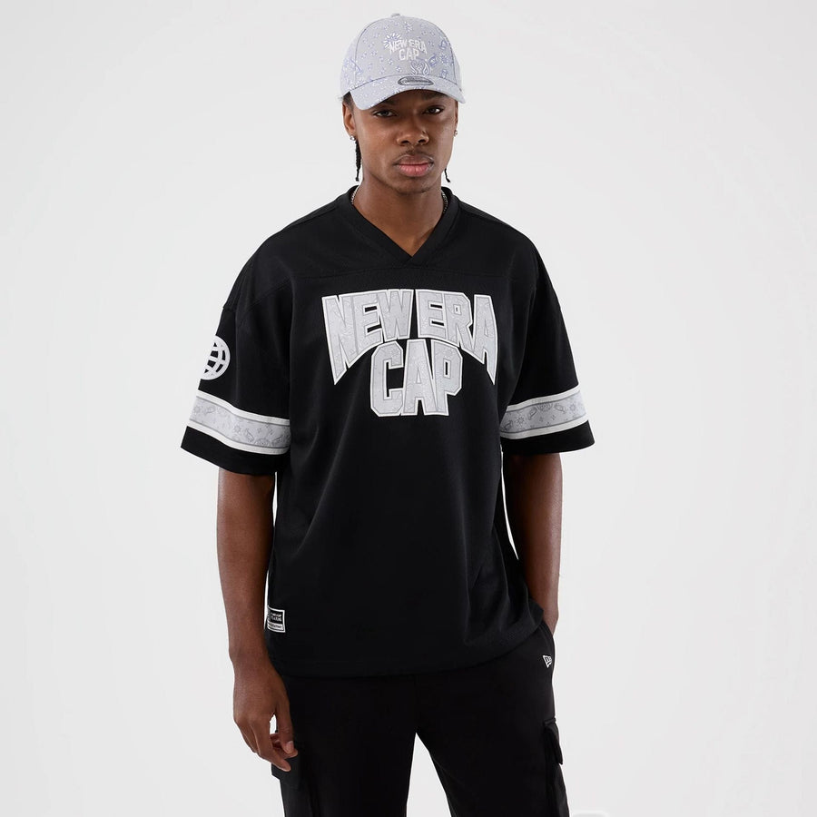 The Male model is wearing  New Era Street Swing Black T-Shirt  1