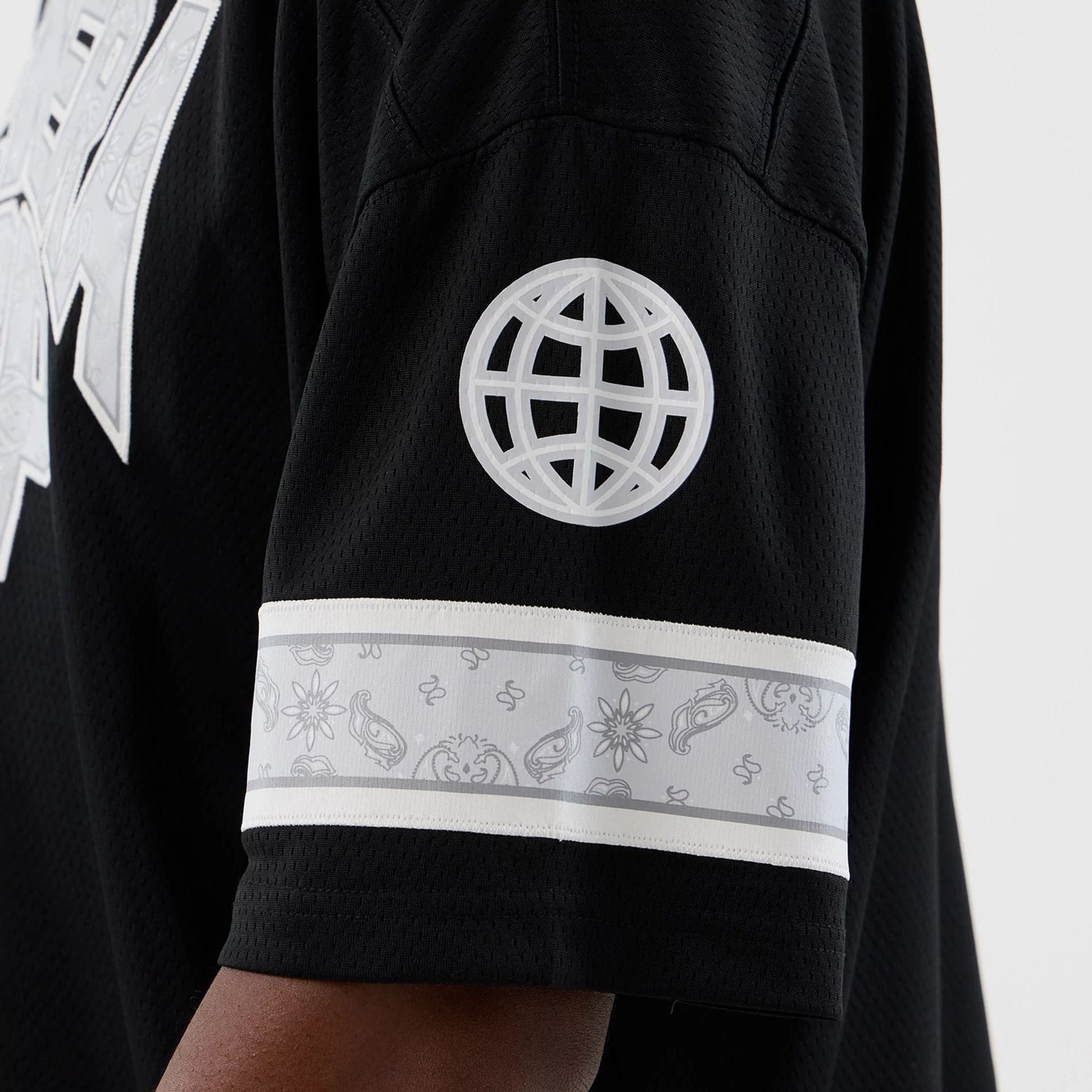 The Male model is wearing  New Era Street Swing Black T-Shirt  6