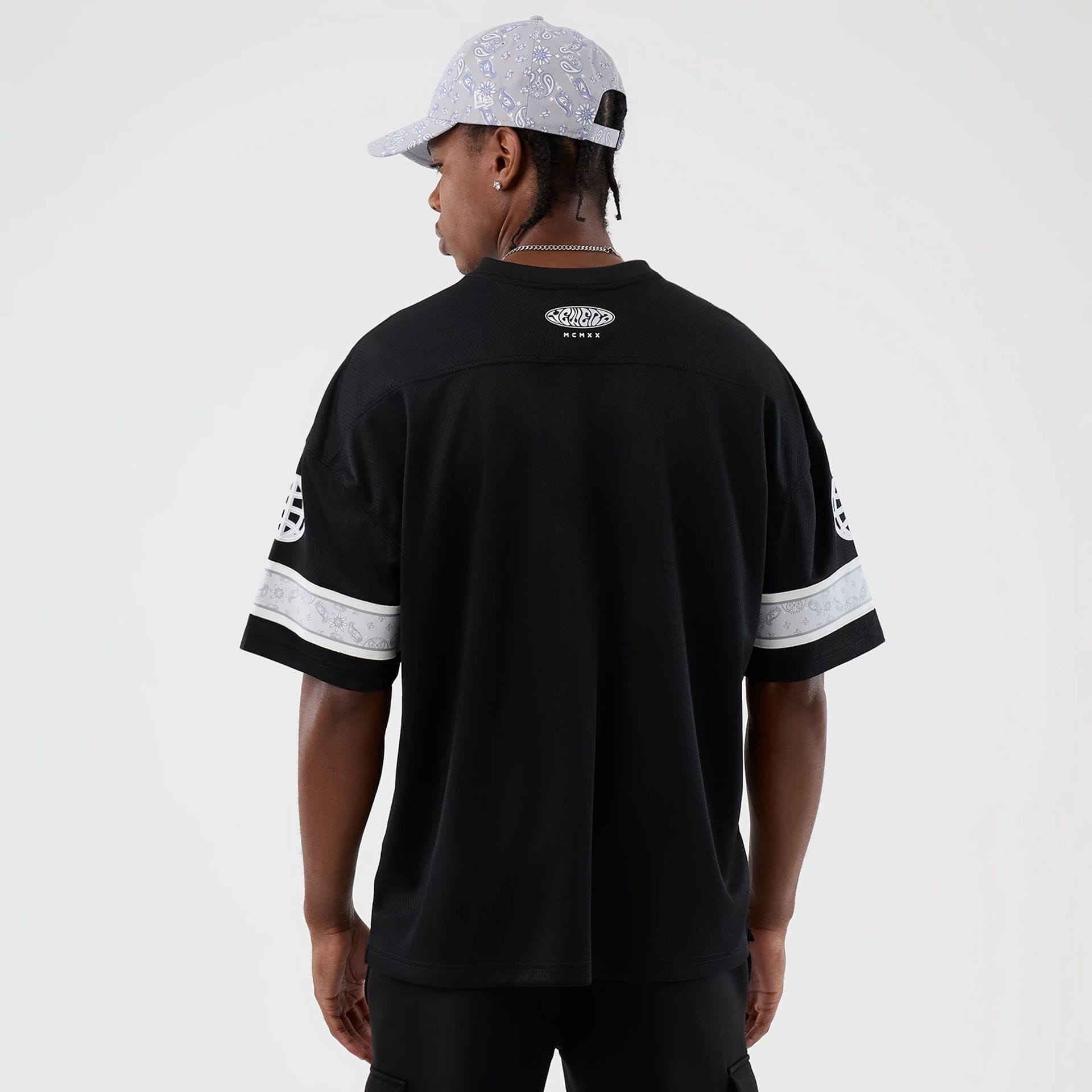 The Male model is wearing  New Era Street Swing Black T-Shirt 2