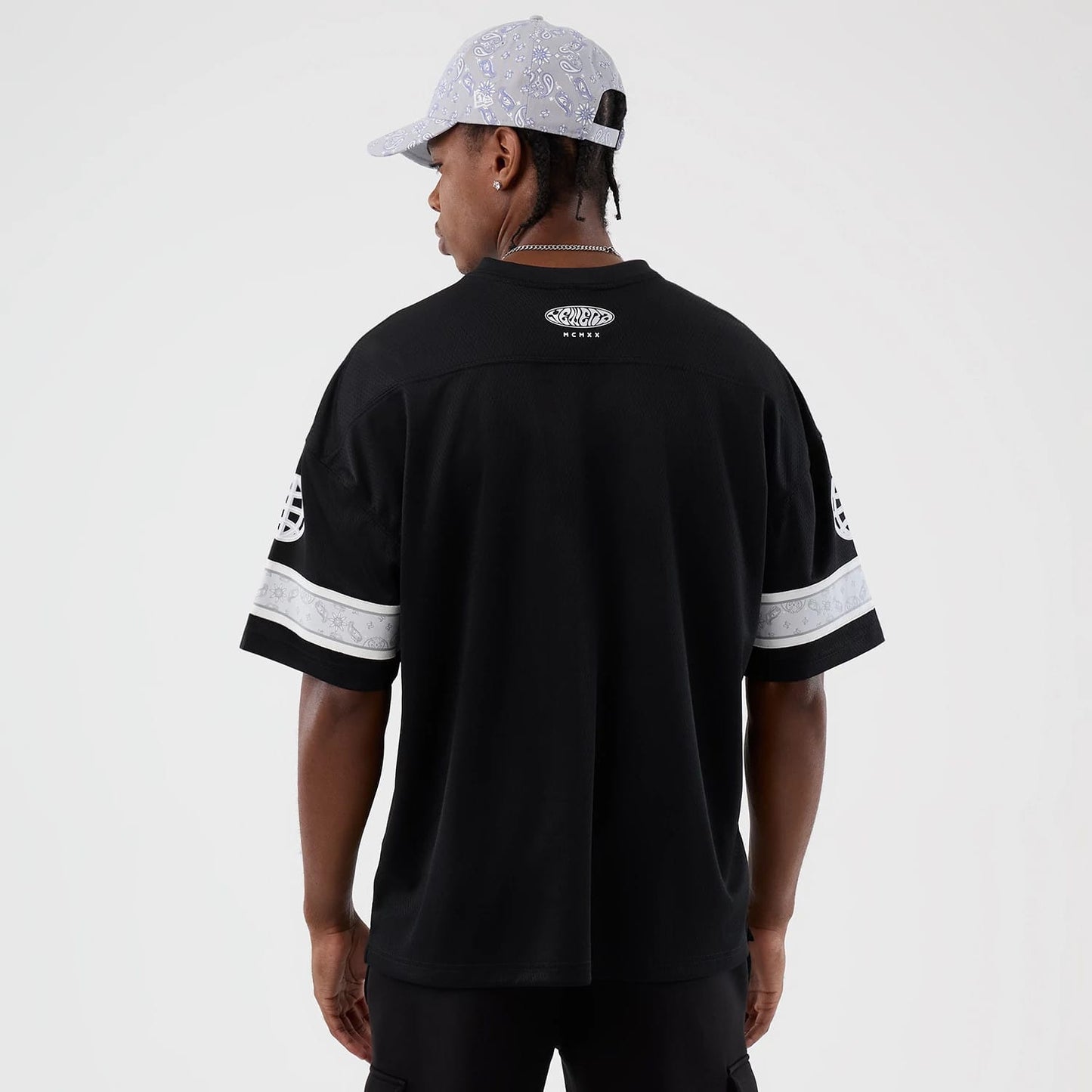 The Male model is wearing  New Era Street Swing Black T-Shirt 2