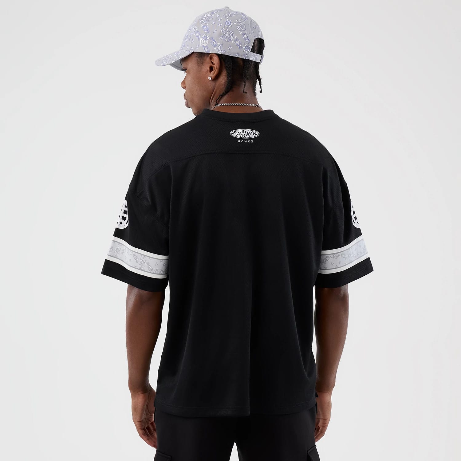 The Male model is wearing  New Era Street Swing Black T-Shirt 2