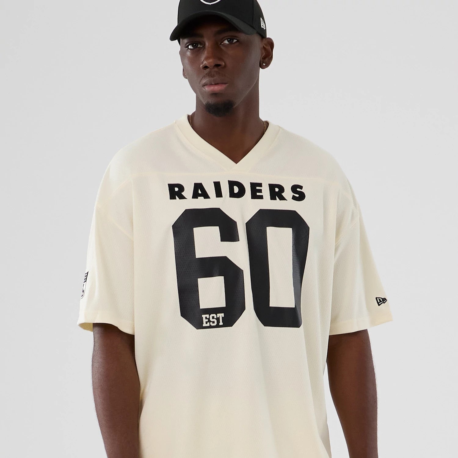The model is wearing this NFL Historic Las Vegas Raiders Oversized T-Shirt in cream. 7