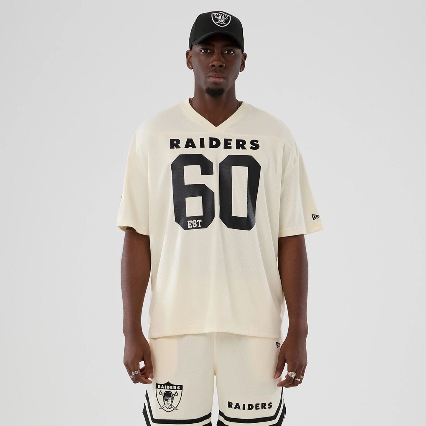 The model is wearing this NFL Historic Las Vegas Raiders Oversized T-Shirt in cream. 1