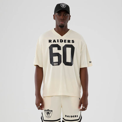The model is wearing this NFL Historic Las Vegas Raiders Oversized T-Shirt in cream. 1