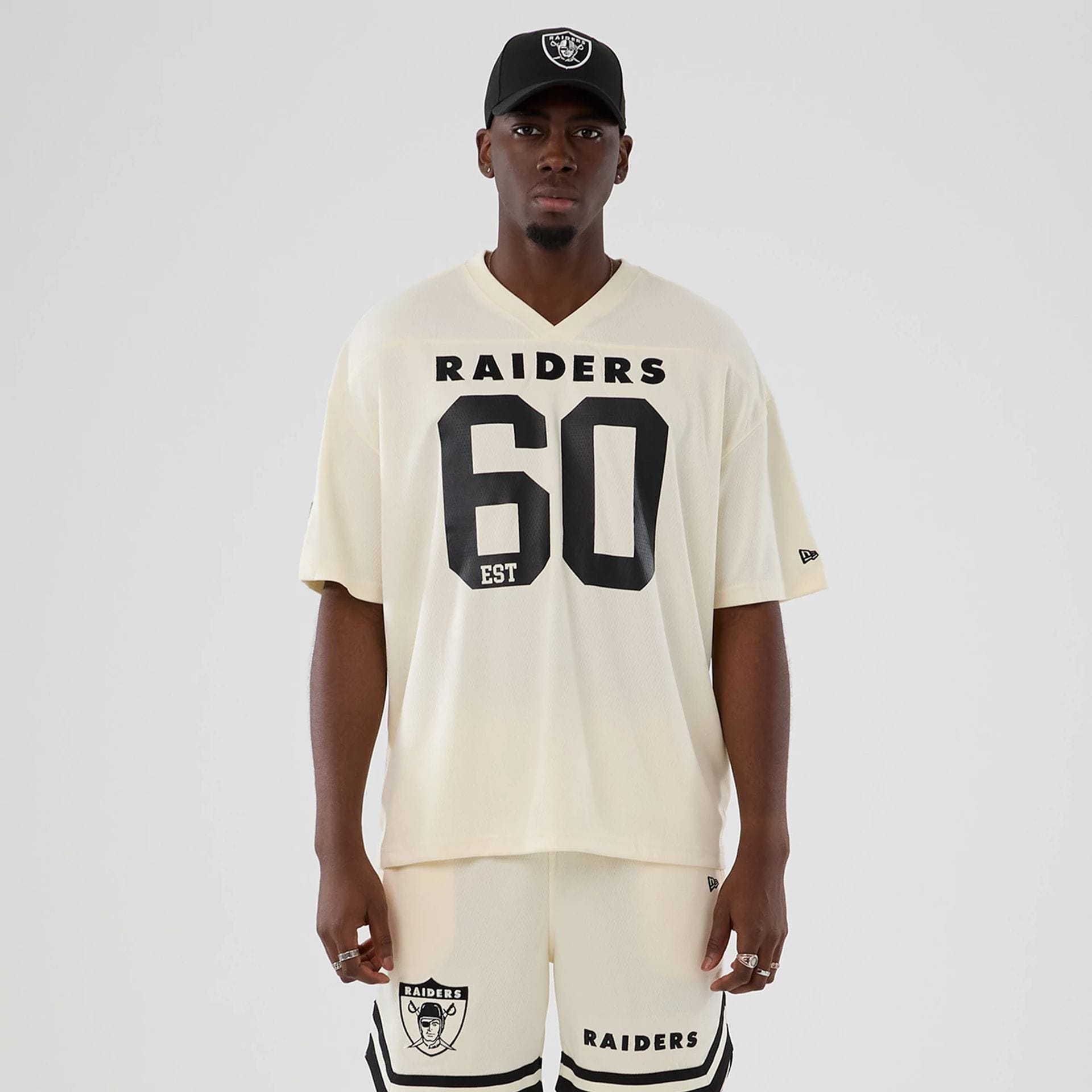 The model is wearing this NFL Historic Las Vegas Raiders Oversized T-Shirt in cream. 1