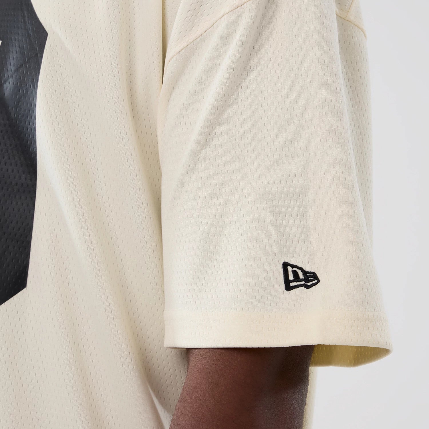 The model is wearing this NFL Historic Las Vegas Raiders Oversized T-Shirt in cream. 5