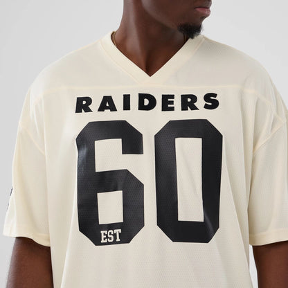 The model is wearing this NFL Historic Las Vegas Raiders Oversized T-Shirt in cream. 3