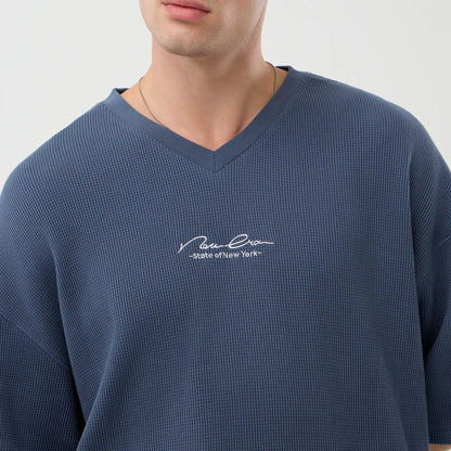 The Male model is wearing New Era Basic Blue T-Shirt 6
