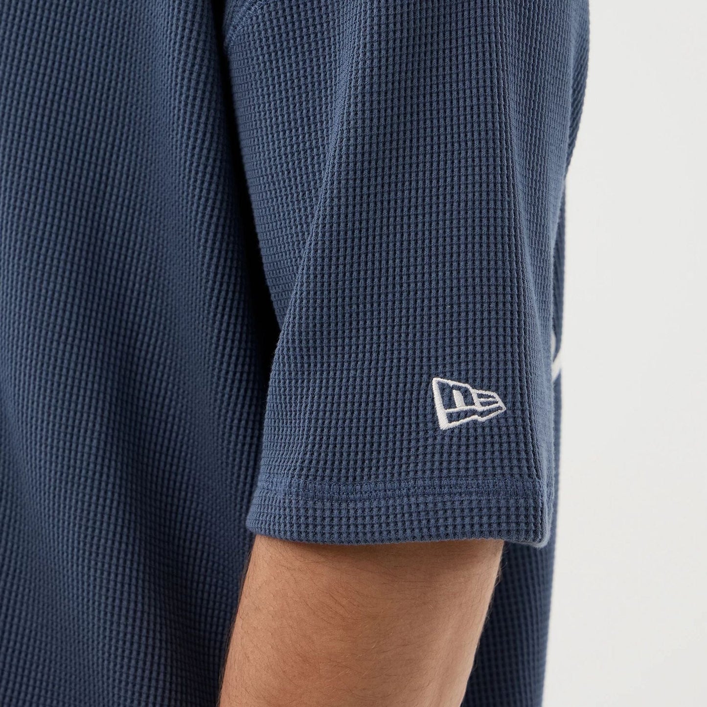 The Male model is wearing New Era Basic Blue T-Shirt 4