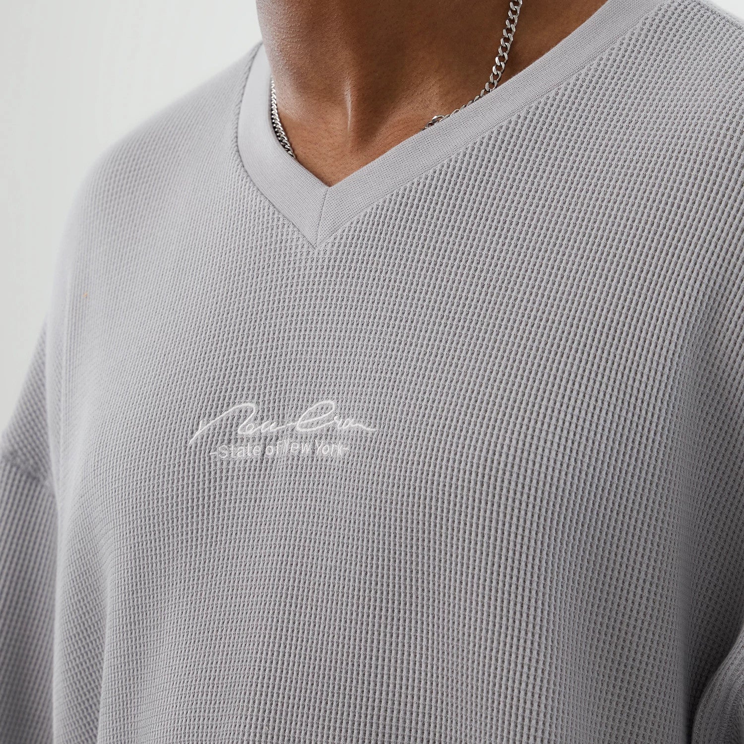 The Male model is wearing New Era Basic Grey T-Shirt 3