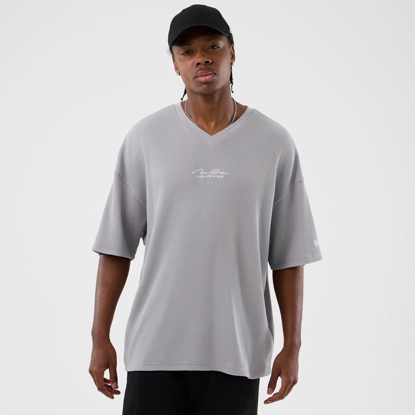The Male model is wearing New Era Basic Grey T-Shirt 1