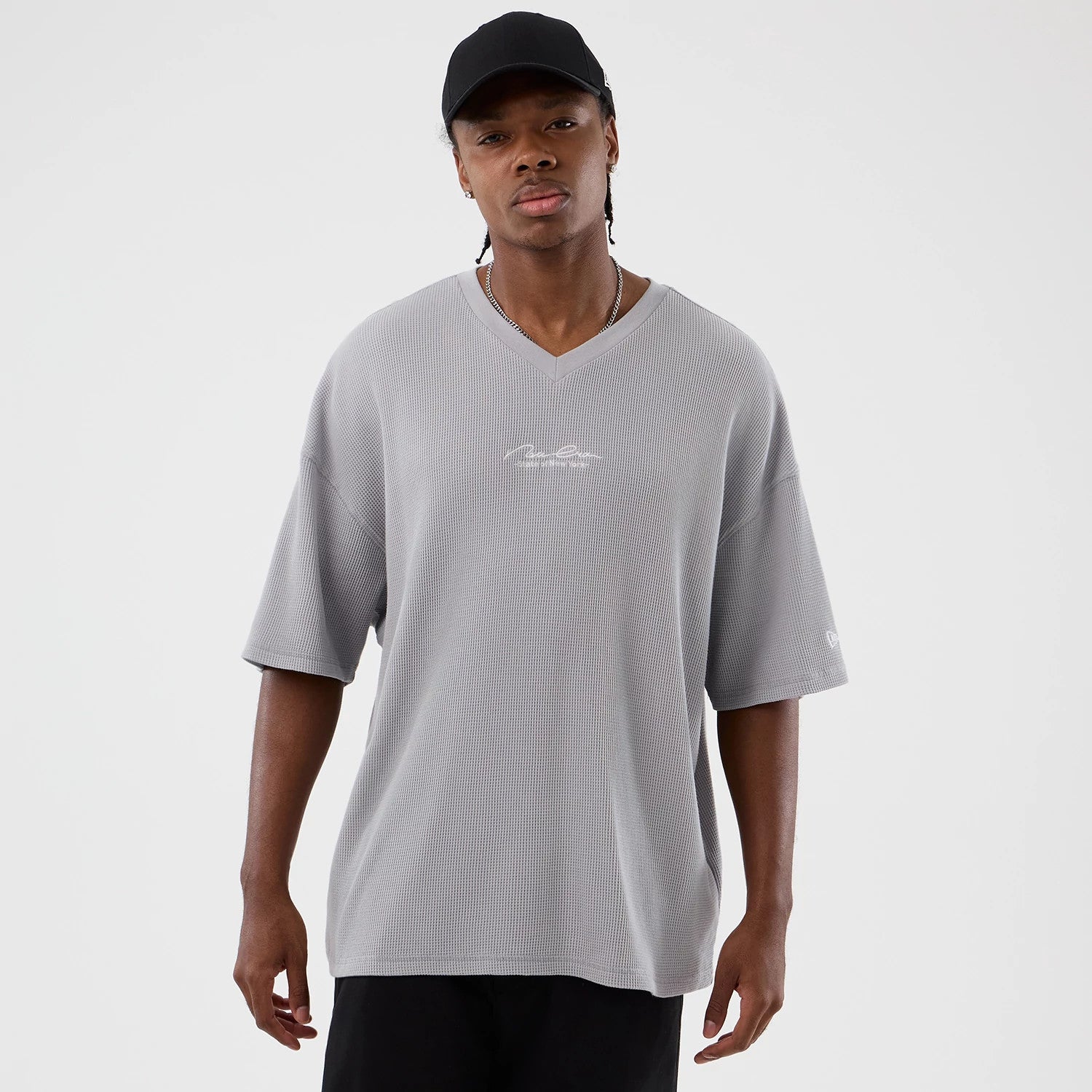 The Male model is wearing New Era Basic Grey T-Shirt 1