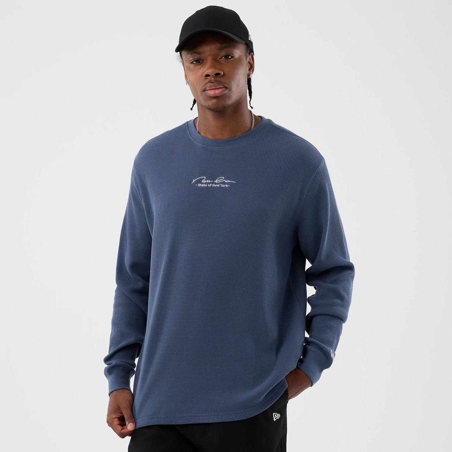 The Male model is wearing New Era Basic Blue Long Sleeve T-Shirt 1