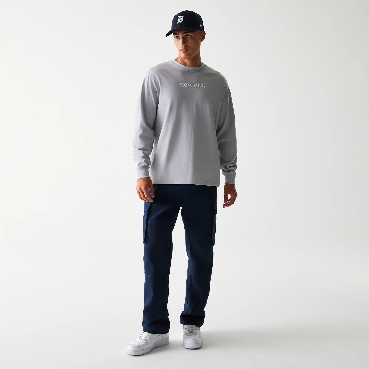 The Male model is wearing New Era 90s Vibe Grey Long Sleeve T-Shirt 3