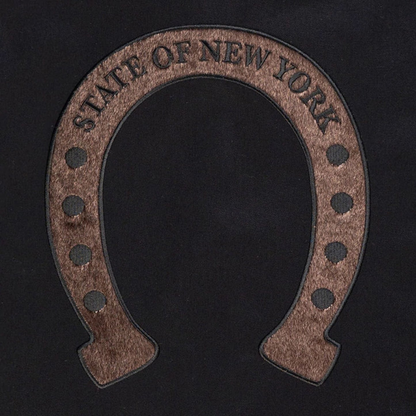 The model is wearing this New Era Year Of The Horse Jacket in black. 3