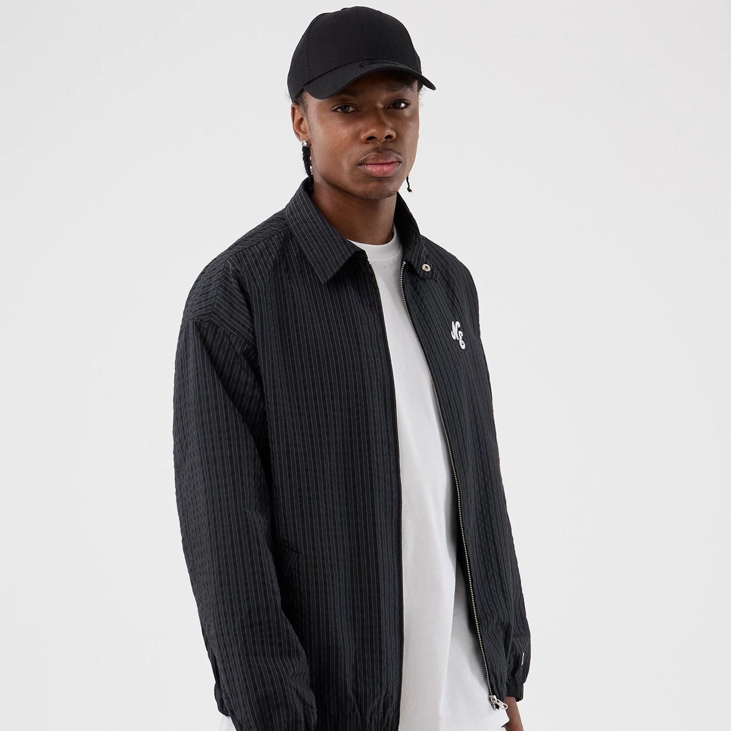 The model is wearing this New Era Street Class jacket in navy. 1