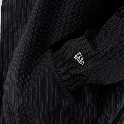 The model is wearing this New Era Street Class jacket in navy. 5