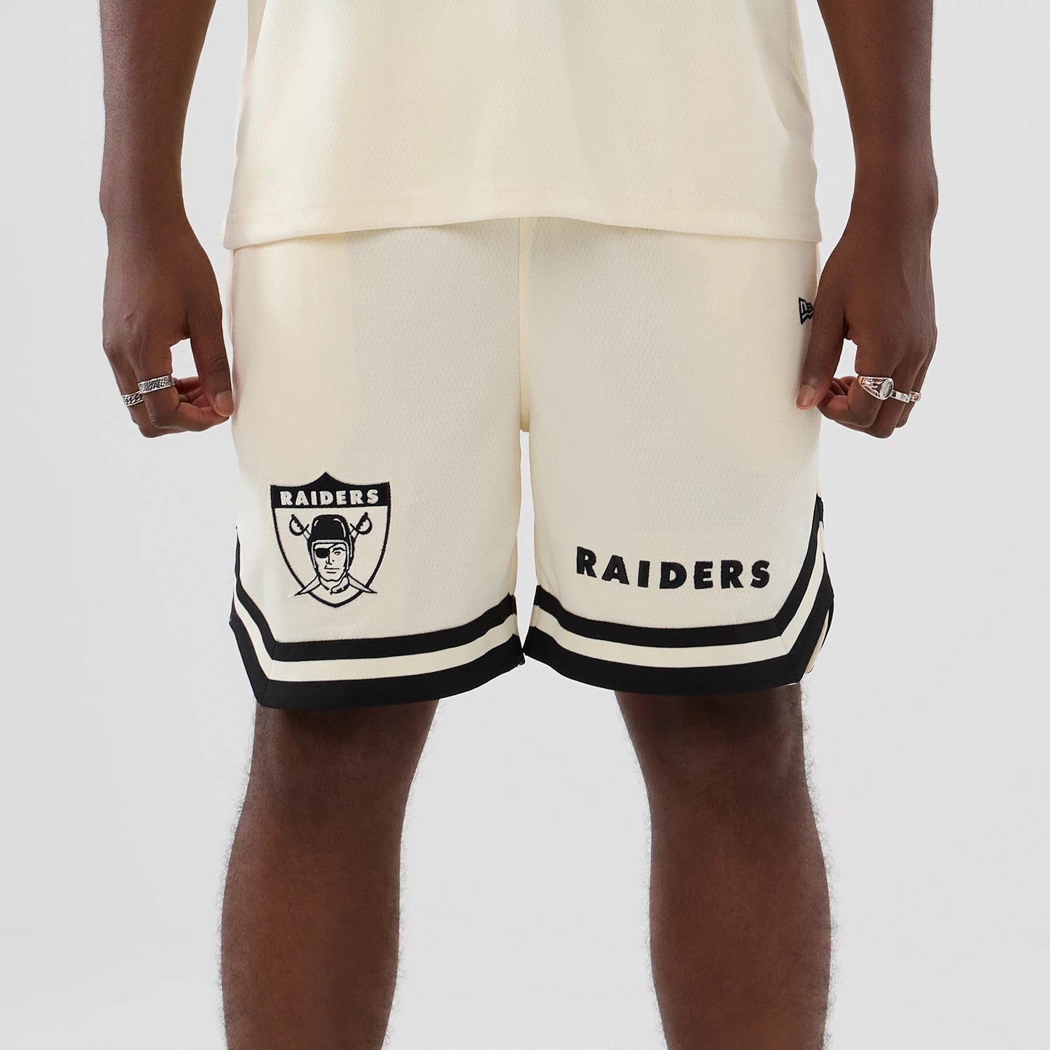The model is wearing these NFL Historic Las Vegas Raiders shorts in cream. 4