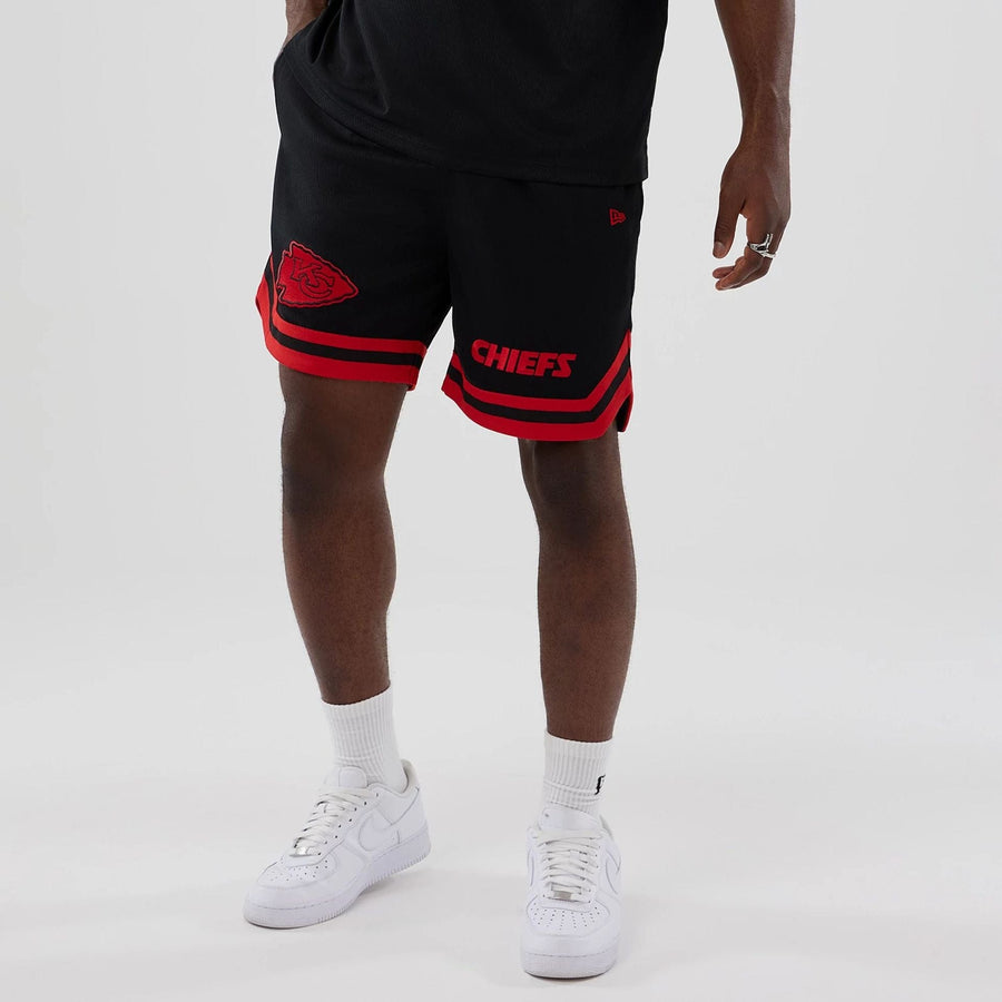 The model is wearing these NFL Historic Kansas City Chiefs shorts in black. 7