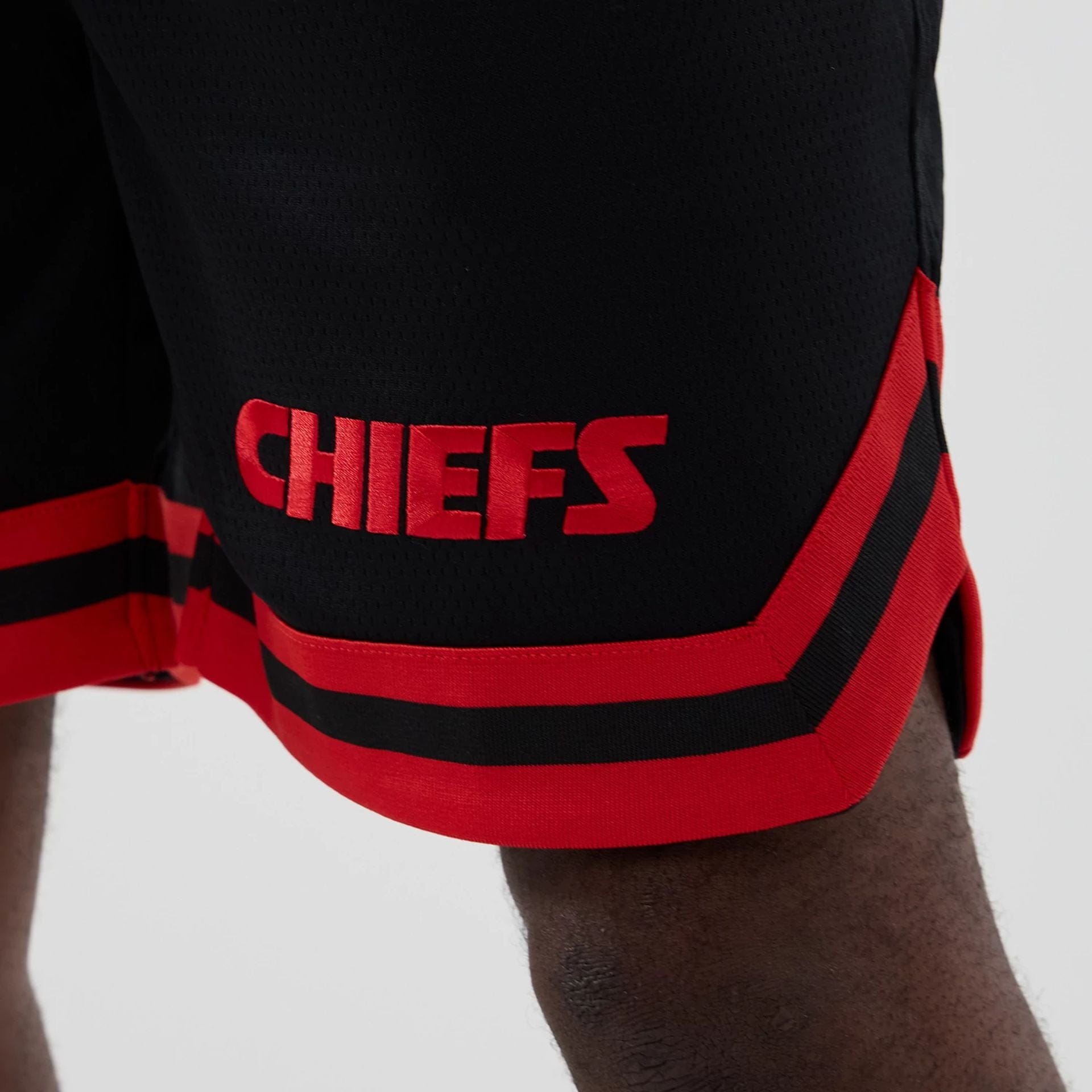 The model is wearing these NFL Historic Kansas City Chiefs shorts in black. 4