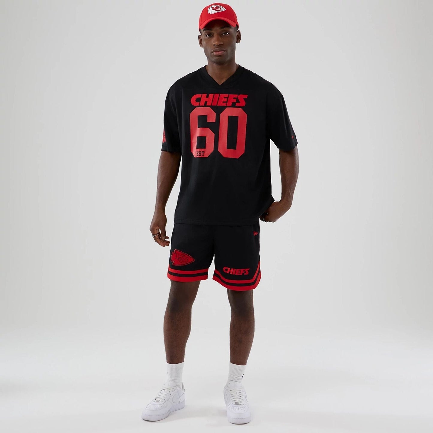 The model is wearing these NFL Historic Kansas City Chiefs shorts in black. 8