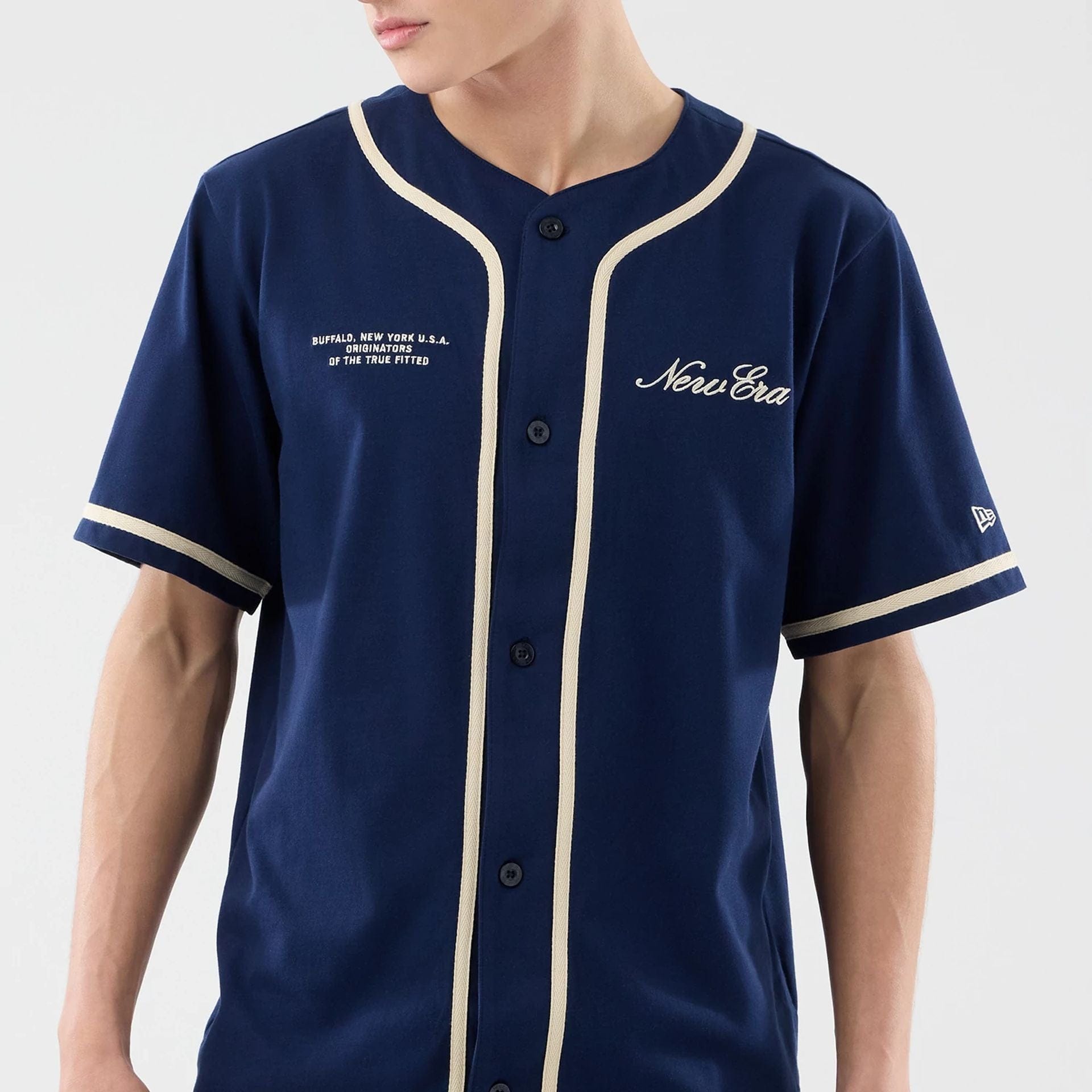 The model is wearing this New Era Oceanside Jersey in blue. 5