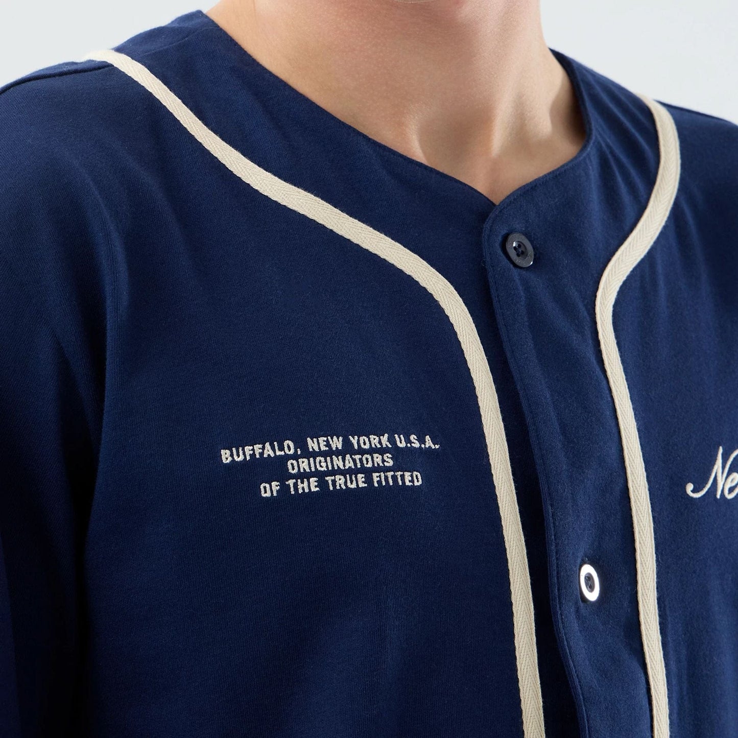 The model is wearing this New Era Oceanside Jersey in blue. 3