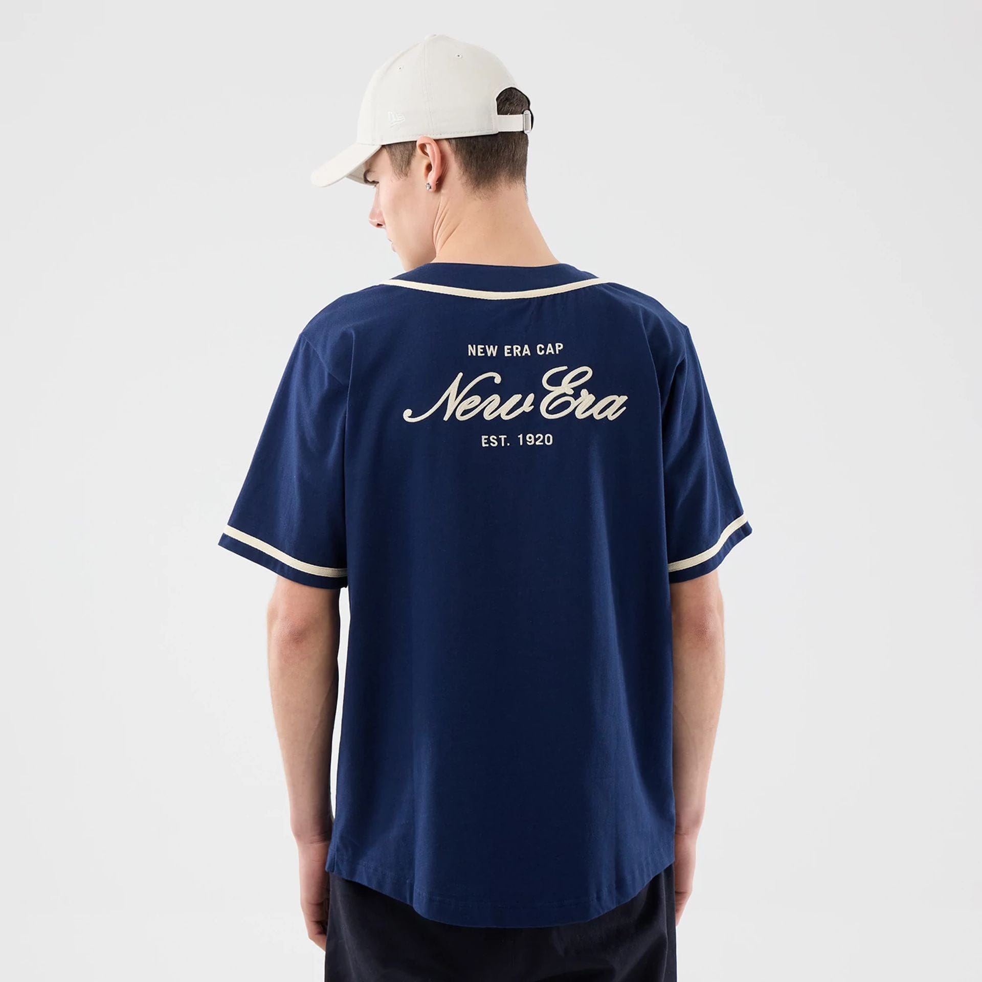 The model is wearing this New Era Oceanside Jersey in blue. 2