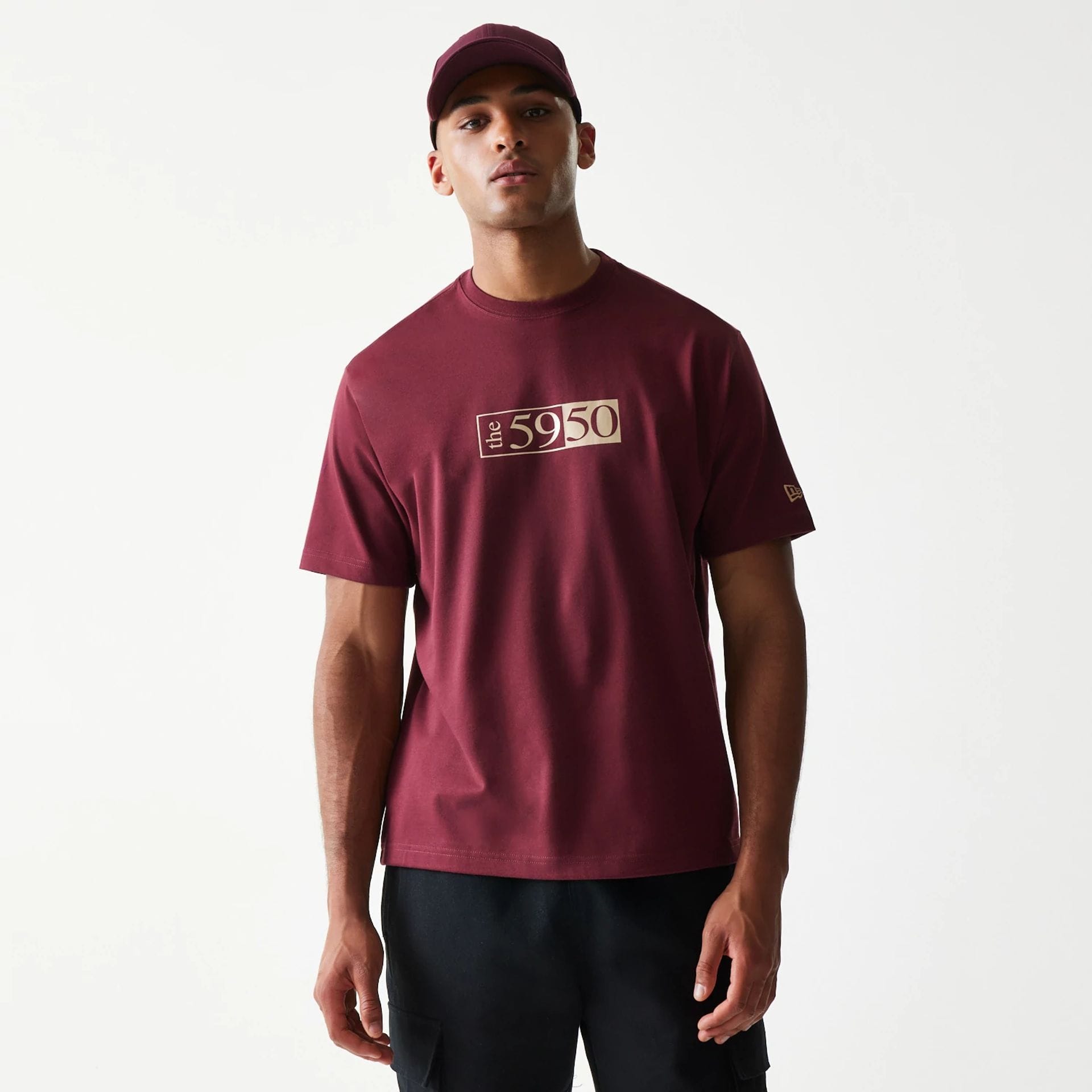 The Male model is wearing A-Frame 59FIFTY Fitted Cap Description Dark Red T-Shirt 1