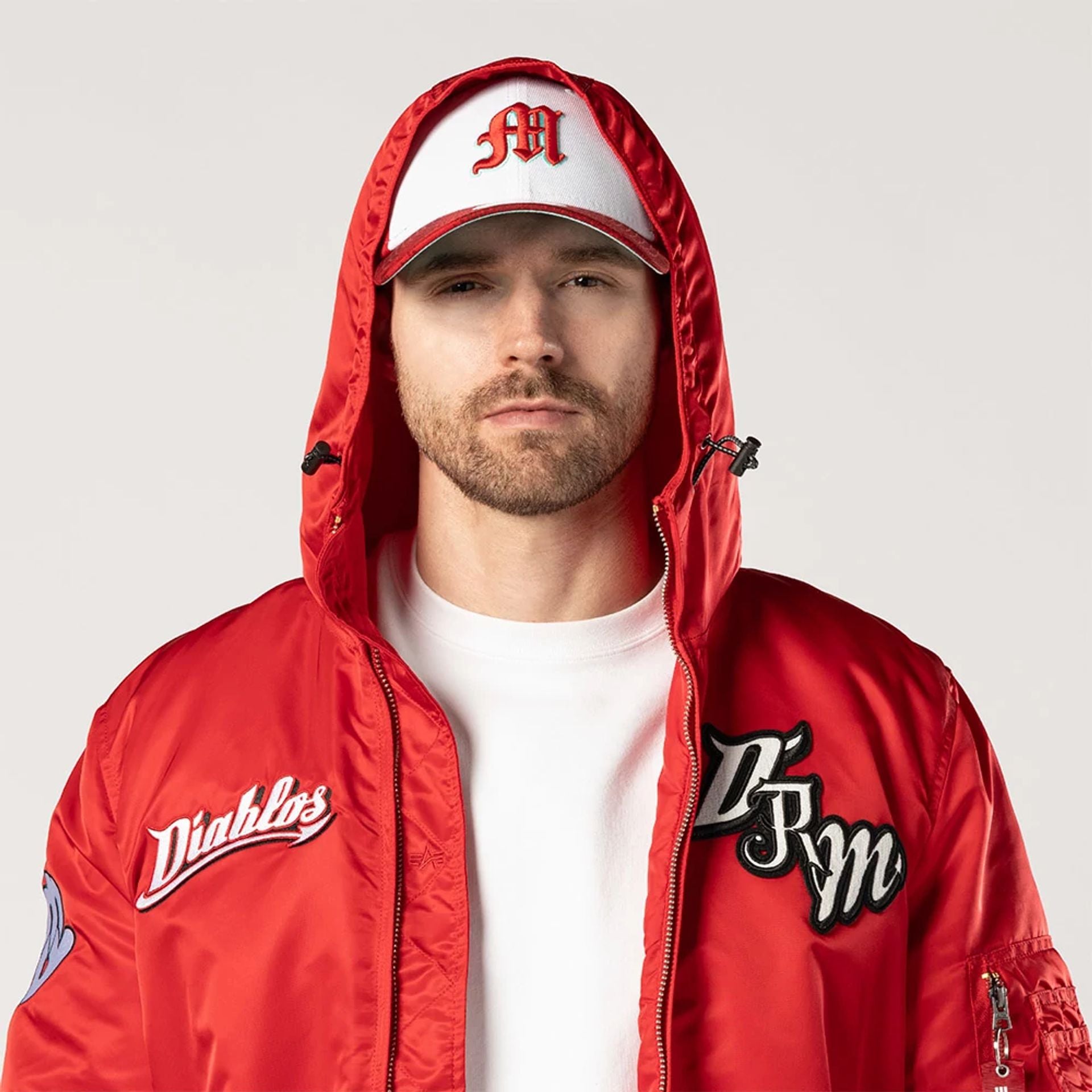 The Male model is wearing Mexico Diablos LMB X Alpha Red Jacket 5