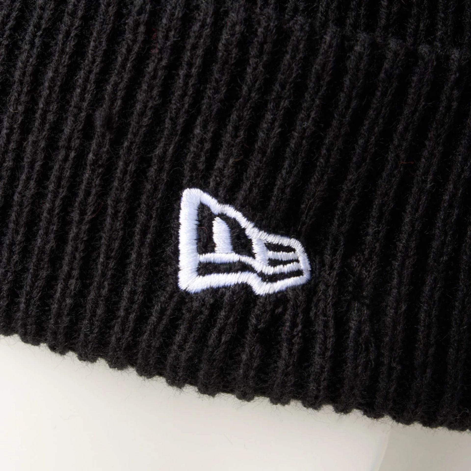 This is a  New Era Black Rib Knit Beanie Hat 6