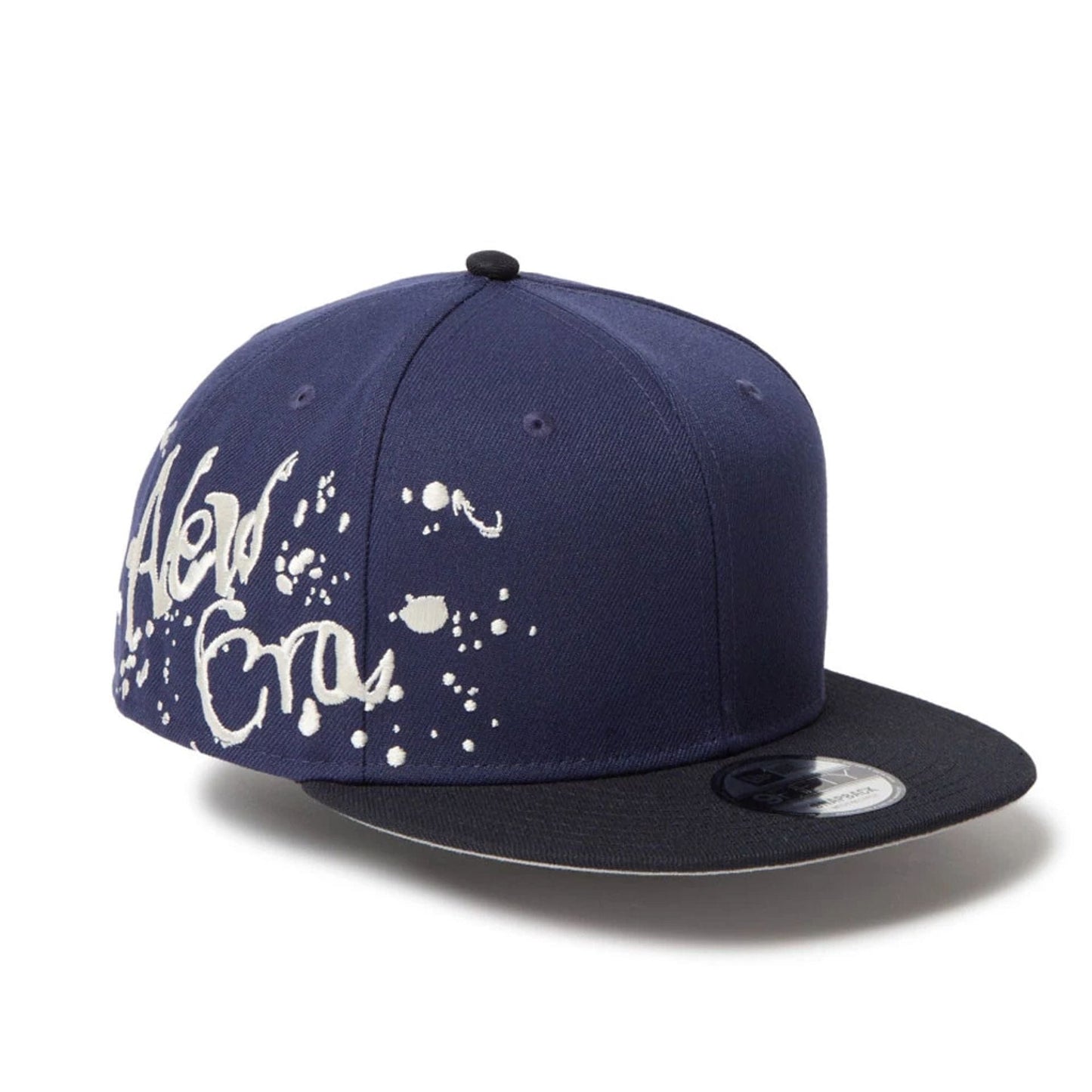 This is a New Era Dripping Emblem Navy 9FIFTY Snapback Adjustable Cap 1